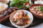 Makdous, walnut-stuffed baby eggplants, served in olive oil with fresh mint.